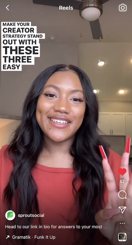 A Reel on Sprout Social's Instagram where an employee from the content team is talking about three ways to craft your creator strategy. She is dressed in a red shirt and holds up her hand with three fingers held up.